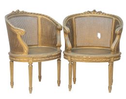 1391.  Pareja de bergeres de madera dorada y asiento de estilo Luis XVI.España, h. 1900.