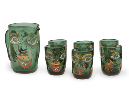 589.  Juego formado por jarra y seis vasos de cristal soplado en verde con caras grotescas, en esmalterojo, blanco y amarillo.Diseño de Anzolo Fuga para Murano, Venecia, h. 1947-48.