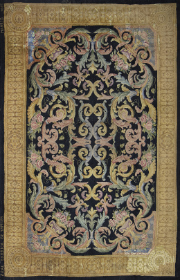 1216.  Alfombra fernandina de nudo español, en lana,  de estilo Savonnerie.Real Fábrica de Tapices, firmada y fechada, Madrid, 1826.