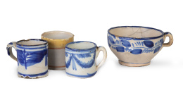 625.  Lote de una taza levantina de cerámica esmaltada en azul y blanco y tres tacitas, una de ellas de Talavera.S. XIX.