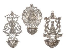 681.  Lote de tres benditeras de plata calada: una con Virgen otra con el Sagrado Corazón del Jesús y otra con la Virgen de Covadonga.S. XX.