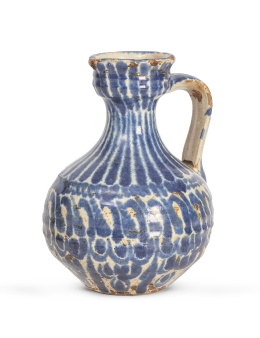 1057.  Jarro o "bombona" en cerámica esmaltada en azul.Fajaluza, S. XIX.