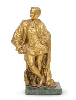 1244.  Personaje masculino en bronce dorado, vestido a la manera d