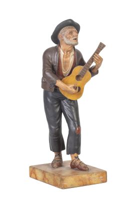 533.  Ciego con guitarra.
Figura escultórica de barro cocido y p