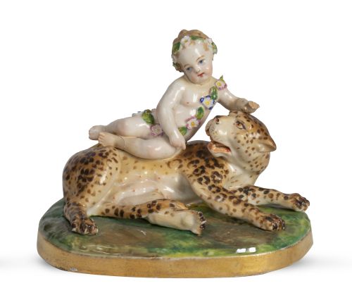 Niño con leopardo.Figura de porcelana esmaltada.S. XIX.