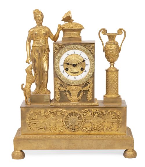 Reloj de bronce dorado de estilo imperio.Francia, S. XIX.